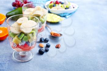 fruit salad in glass, fresh fruits and berries