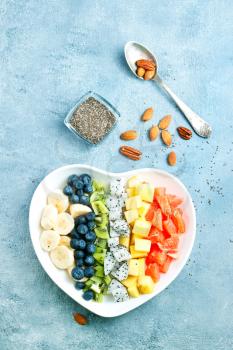 salad with fresh berries and fruits in bowl