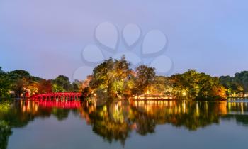 The Huc Bridge and the Temple of the Jade Mountain on Hoan Kiem Lake in Hanoi at night. Vietnam
