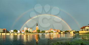 Double rainbow above Elblag town in the Warmian-Masurian Voivodeship of Poland
