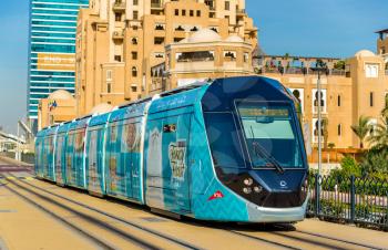 Alstom Citadis 402 tram on December 31, 2015 in Dubai, UAE. The system is wireless as it uses a ground-level power supply