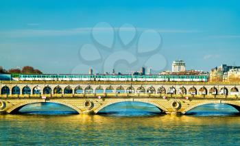 Metro train on the Pont de Bercy, a bridge over the Seine in Paris, the capital of France