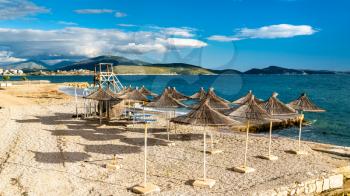 Straw umbrellas on a beach in Sarande, South Albania