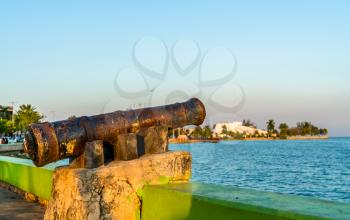 Old rusty cannon at the seaside promenade in Chetumal, the Quintana Roo State of Mexico