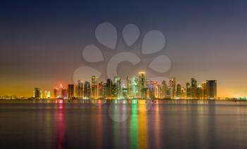 Skyline of Doha at night. Qatar, the Middle East
