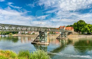 Eiserner Steg bridge across the Danube River in Regensburg - Bavaria, Germany