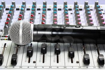 Mixing console and a wireless microphone closeup