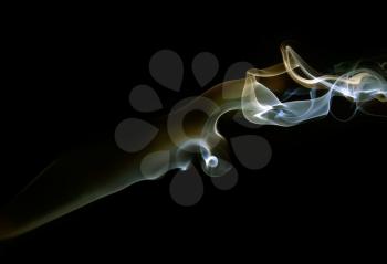 Abstract colored smoke on a dark background.
