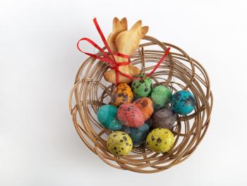 Easter basket with cookies in the form of rabbits and quail eggs. Top view.