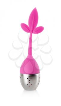 Tea infuser with metallic container and pink rubber handle with leaves. Isolated on white background.