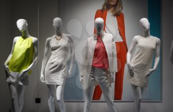 Fashion concept. Photo four elegant female mannequins demonstrating clothes.
