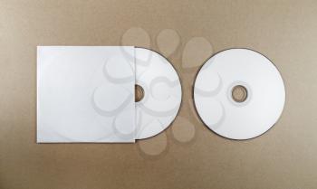 Blank compact disk on a table. Template for branding identity for designers. Top view.