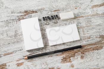 Bank business cards, pencil, eraser, badge and sharpener on vintage wooden table background. Blank stationery and corporate identity template. ID mockup. Mock up for branding identity.