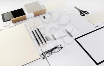 Photo of blank stationery set on paper background. Responsive design mockup. ID template.