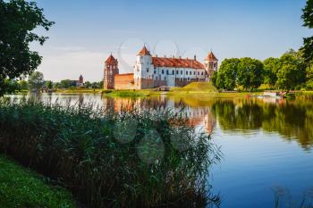 Mir, Belarus - August 11, 2017: Ancient medieval castle on the shore of the lake. Castle in Mir, Belarus - historical heritage of Belarus. UNESCO World Heritage.