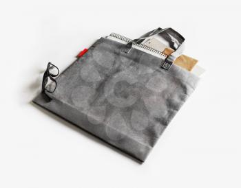 Blank gray shopping bag on white paper background.