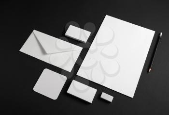 Template for branding identity. Blank stationery set on black paper background. Objects for placing your design.