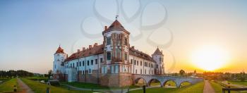 Mir, Belarus - August 11, 2016: Medieval castle in Mir, Belarus. Ancient fortress with towers at sunset. UNESCO World Heritage. Panoramic shot.