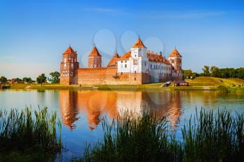 Mir, Belarus - August 11, 2016: Ancient medieval fortress on the shore of the lake. Architectural monument of the middle ages - Mir Castle. UNESCO World Heritage.