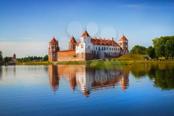 Mir, Belarus - August 11, 2016: Ancient medieval fortress on the shore of the lake. Castle in Mir, Belarus - historical heritage of Belarus. UNESCO World Heritage. Traveling on Belarus