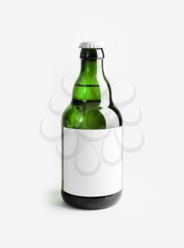 Green beer bottle with blank label. Template for placing your design. Vertical shot.