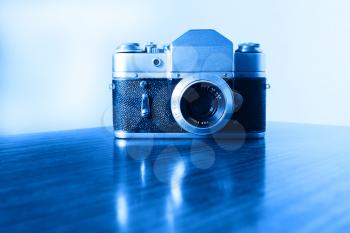 Horizontal vintage blue rangefinder camera background