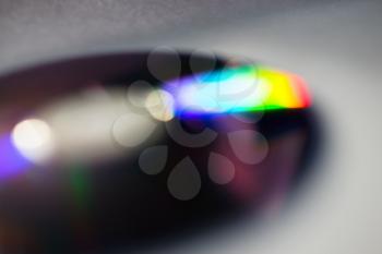 Horizontal cd disc with color reflection bokeh background
