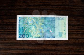 200 Norwegian krones back on wood desk background hd