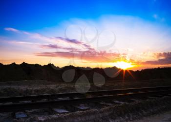 Horizontal vivid sunset on vintage railroad railway landscape background backdrop