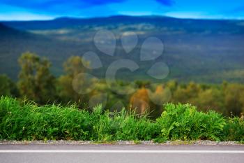 Horizontal mountain road with grass border background hd