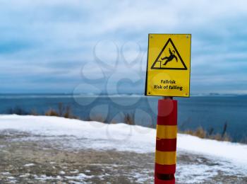 Horizontal vivid Risk of falling danger sign bokeh background backdrop