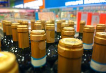 Diagonal bottles of wine bokeh background