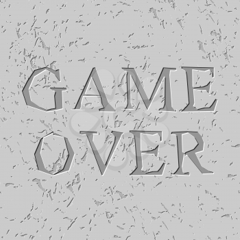 Game over letters carved on stone plate. Chips on rock
