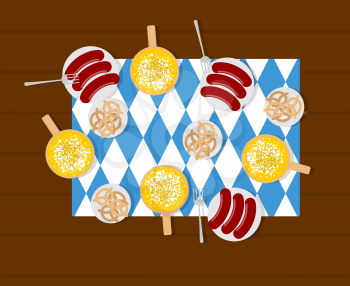 Oktoberfest food. Beer and sausages. Pretzels in plate. Meal for German festival
