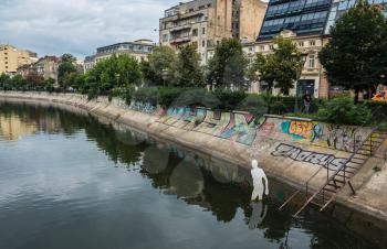 BUCHAREST, ROMANIA - 07.20.2018. Old Center of Bucharest, Romania in a cloudy summer morning. Sullen and unpleasant atmosphere, dirty streets and shabby buildings.