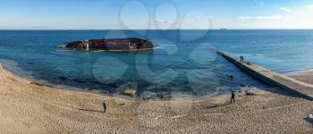 Odessa, Ukraine 12.04.2019. The wreck of a small tanker `DELFI` off the coast of Odessa on a sunny winter day