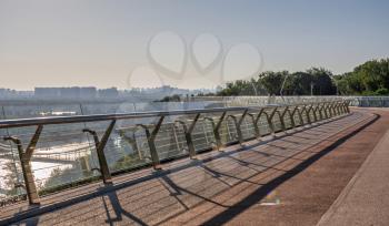 Kyiv, Ukraine 07.11.2020. Pedestrian glass bridge in Kyiv, Ukraine, on a sunny summer morning
