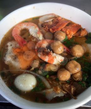 Big closup bowl of Banh Canh, Vietnamese traditional soup with big rice noodles. Crab Noodle Soup. Mobile Photo
