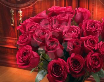 Red roses bouquet over furniture background