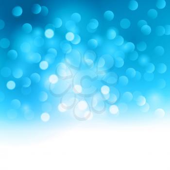 Blurred abstract background with blue and white bokeh