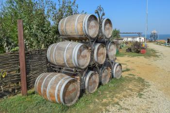 Russia, Ataman - 26 September 2015: Stacked wine barrels. Decoration of the barrels in the village Ataman.