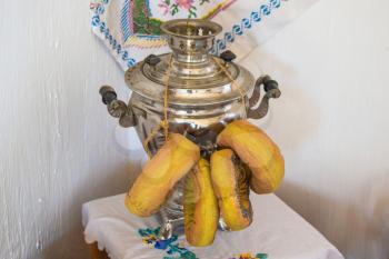 Samovar with bagels fabric. Museum samovar with decoration.