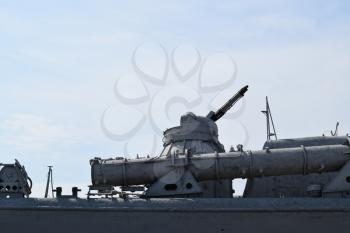 Part of the deck of a warship. communication devices and deck guns