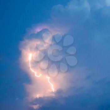 Lightnings in storm clouds. Peals of a thunder and the sparkling lightnings in clouds.