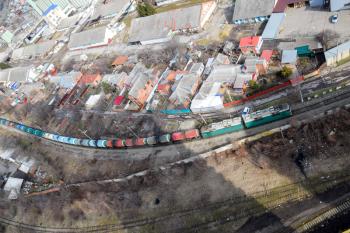 Freight train traveling through the city buildings