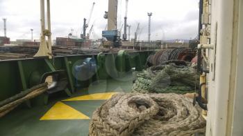 Novorossiysk, Russia - August 11, 2016: The ship's deck with ropes. Mooring ropes. Industrial port