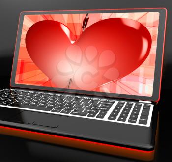Heart On Laptop Showing Cupid Shot Or Passion
