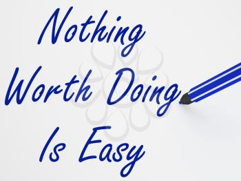 Nothing Worth Doing Is Easy On Whiteboard Showing Determination And Motivation