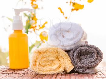 Spa Themed Collage Composed of Relaxing Oils and Towels