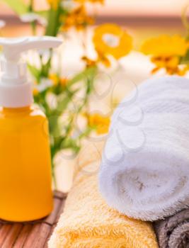 Spa Themed Collage Composed of Natural Oils and Towels